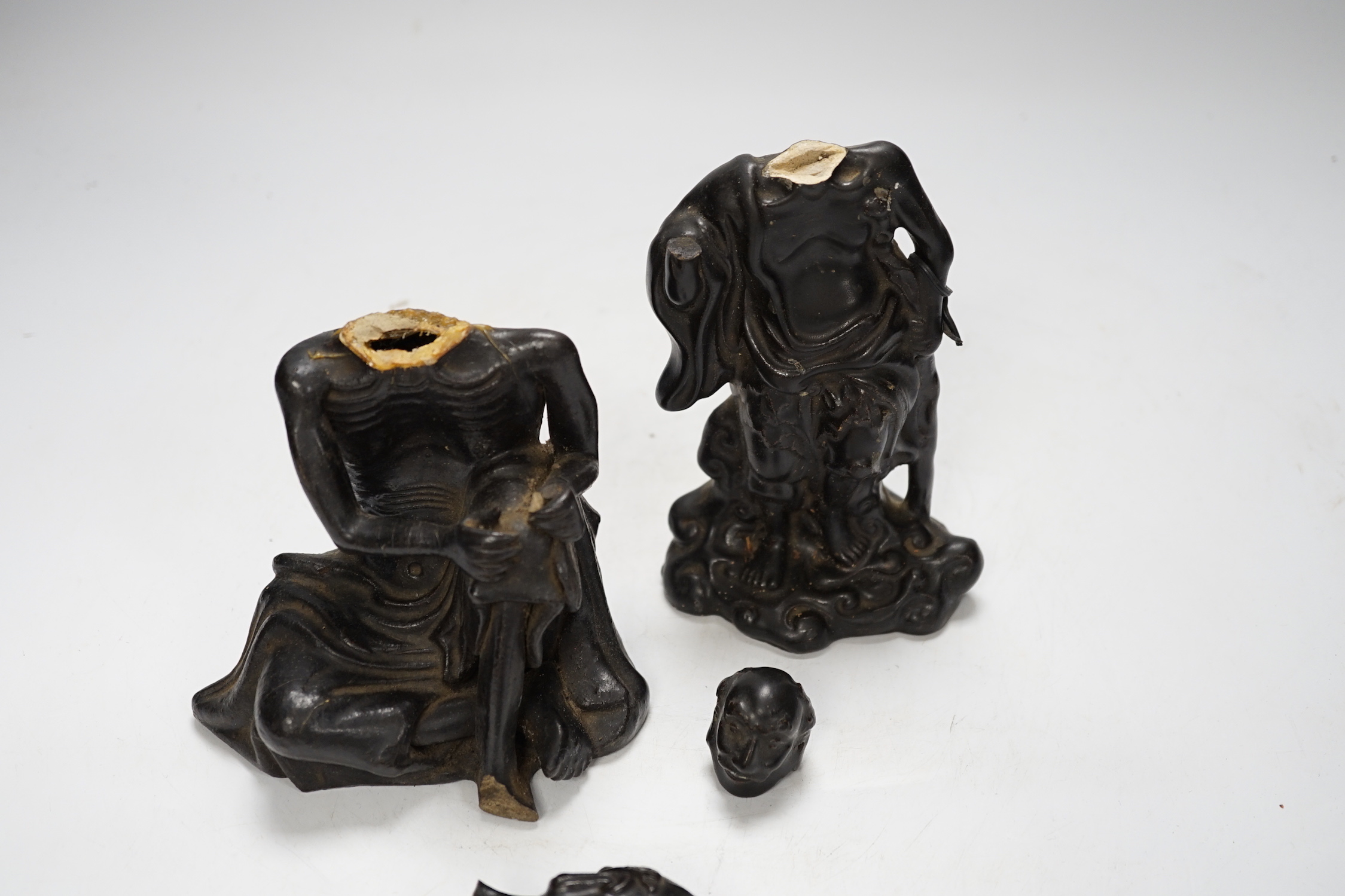 Two Chinese pottery figures of luohan, damaged, 15.5cm